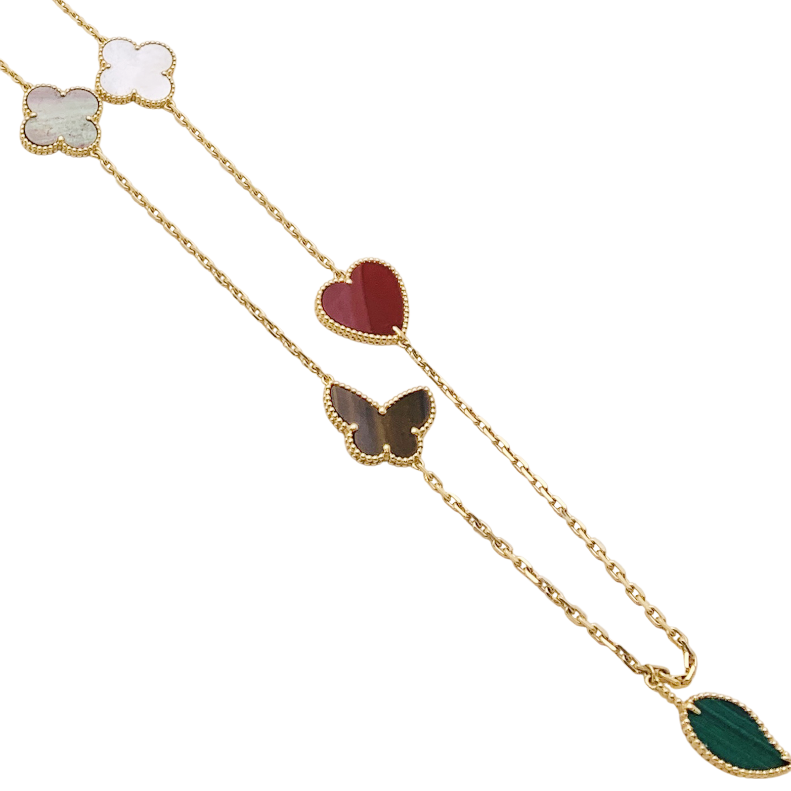 Collier-Sautoir Van Cleef & Arpels, "Lucky Alhambra", or jaune, cornaline, malachite, oeil de tigre, nacre.