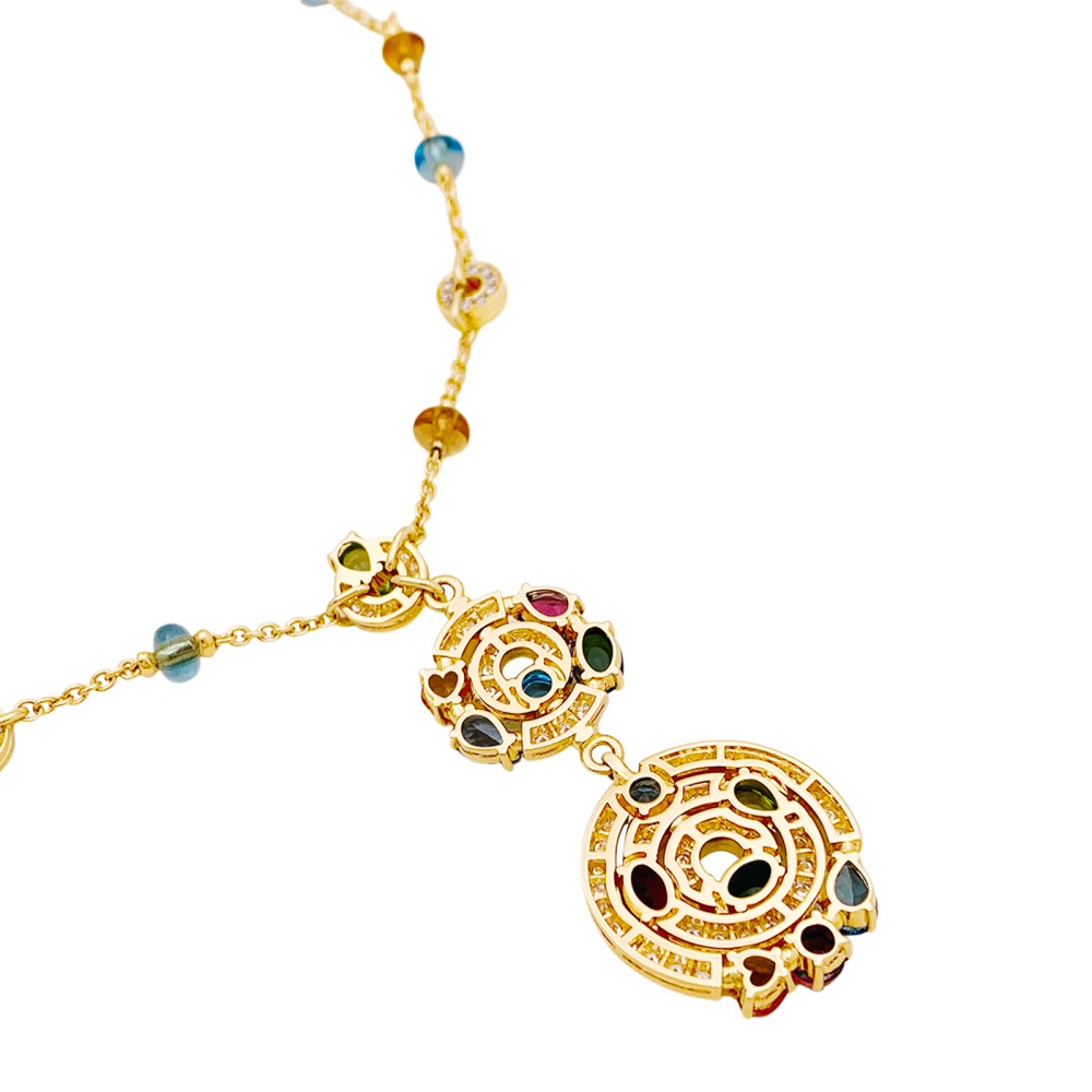 Collier BULGARI "Astrale", or jaune, diamants et pierres de couleur.