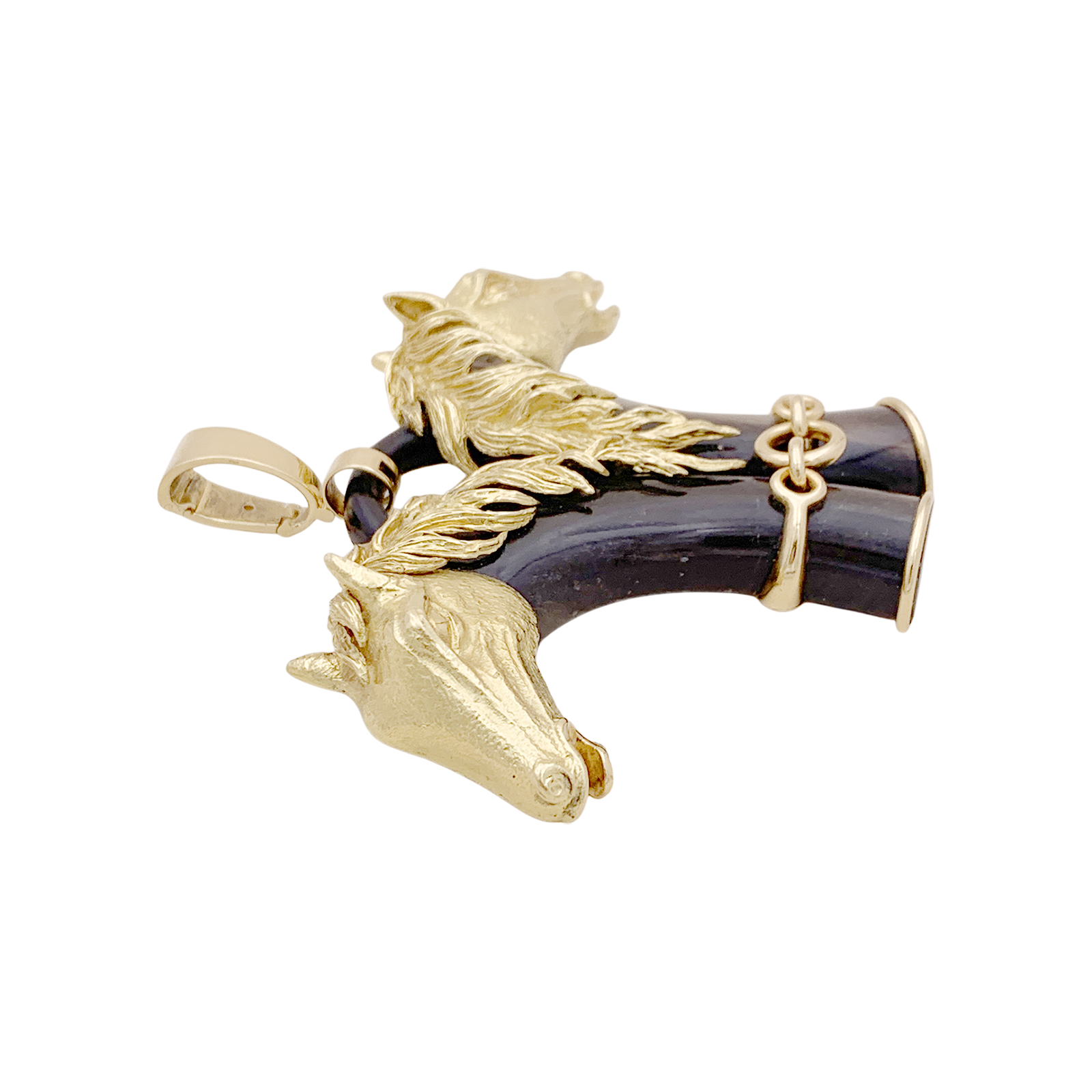 Pendentif FRED double tête de cheval en or jaune et corne.
