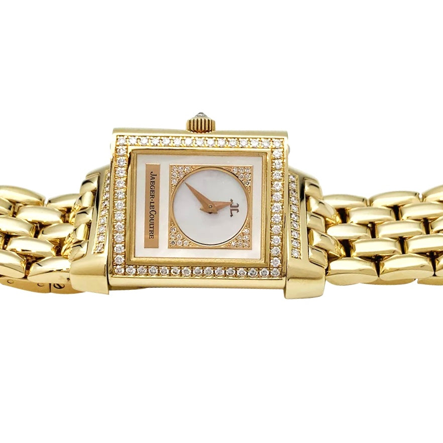 Montre Jaeger Lecoultre "Reverso Duetto" en or jaune, nacre et diamants.