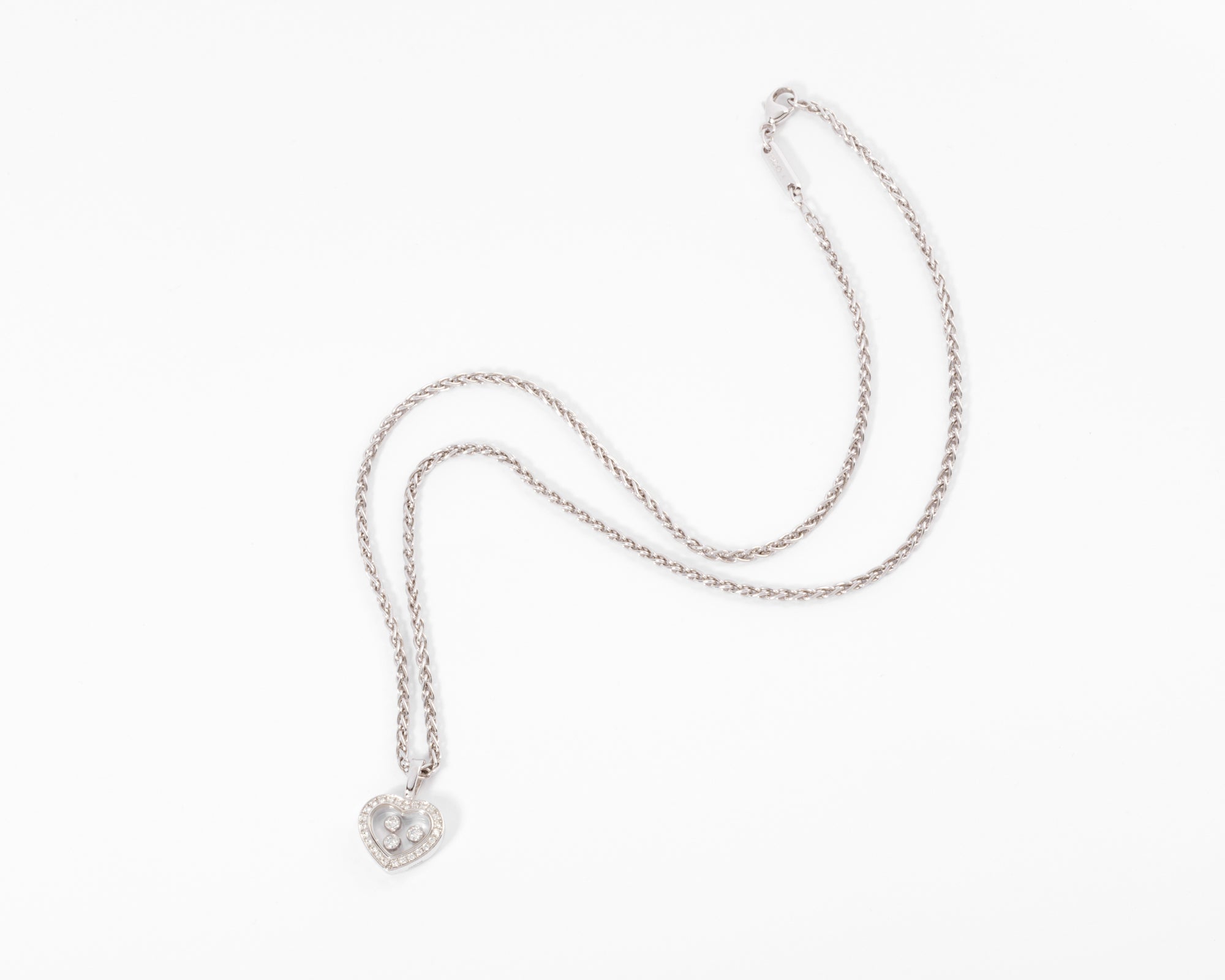 Chopard, pendentif or gris signé