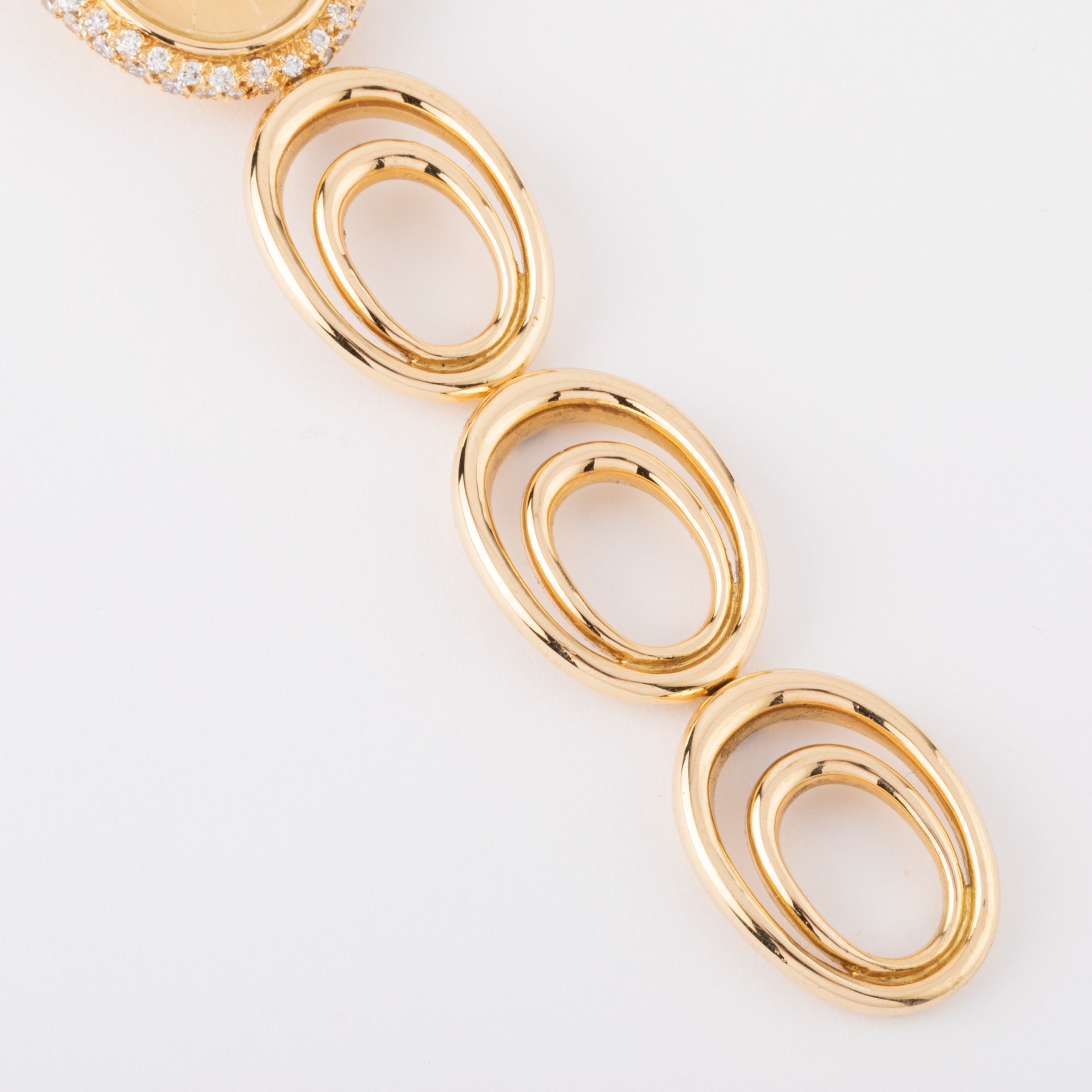 Boucheron, a gold and diamond watch on gold