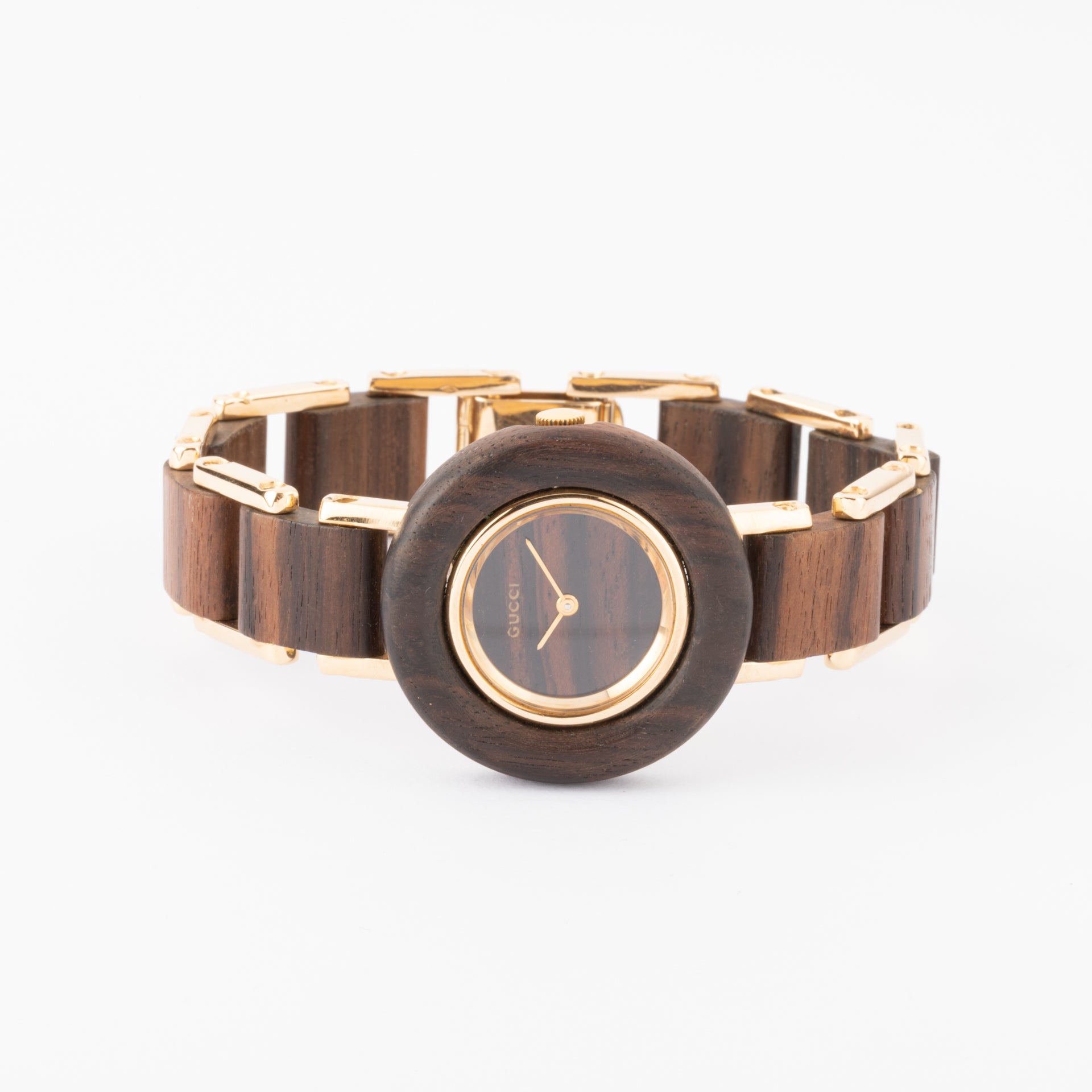 Gucci, a vintage watch in yellow gold and amourette wood