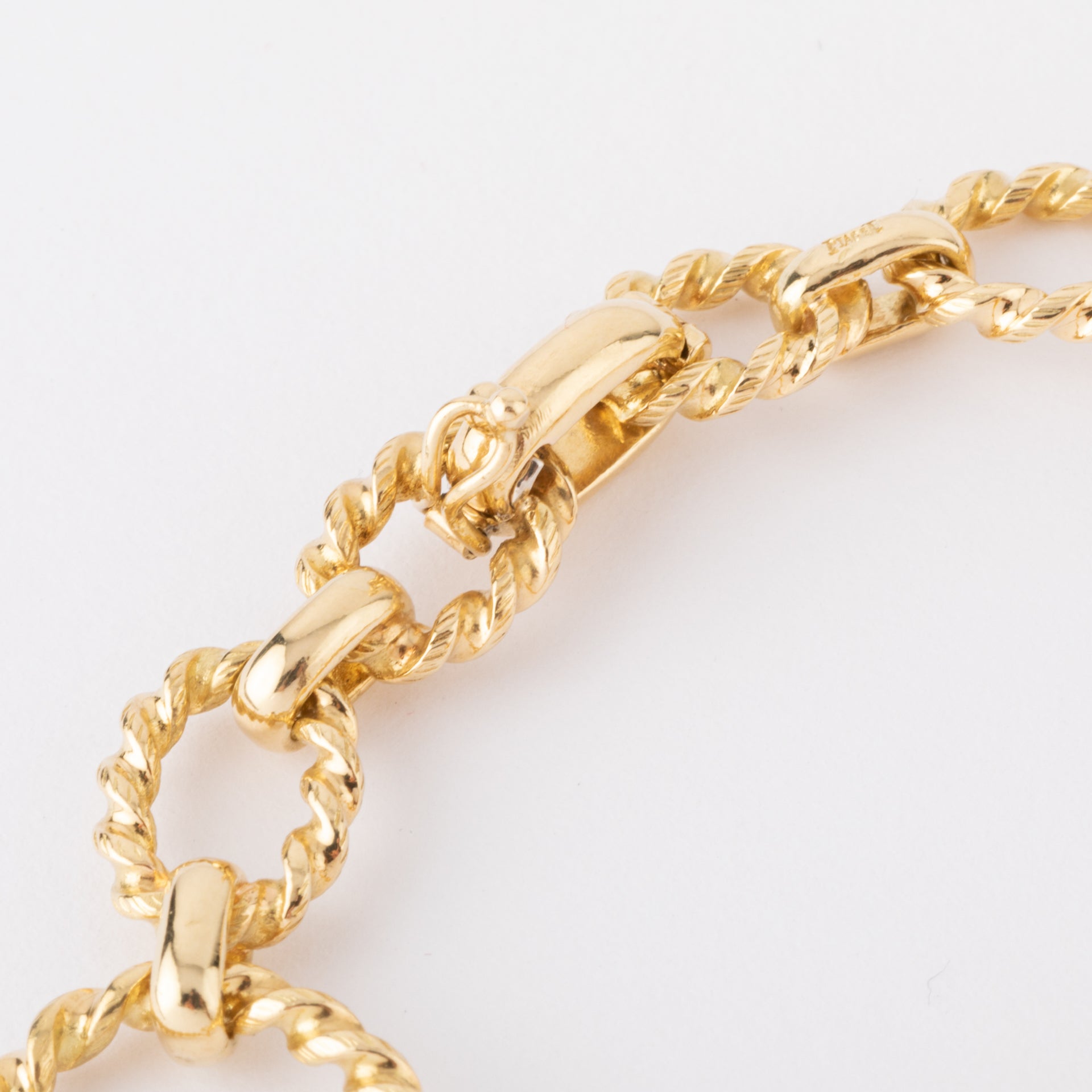 Vintage Piaget, a gold and tiger's eye watch on gold.
