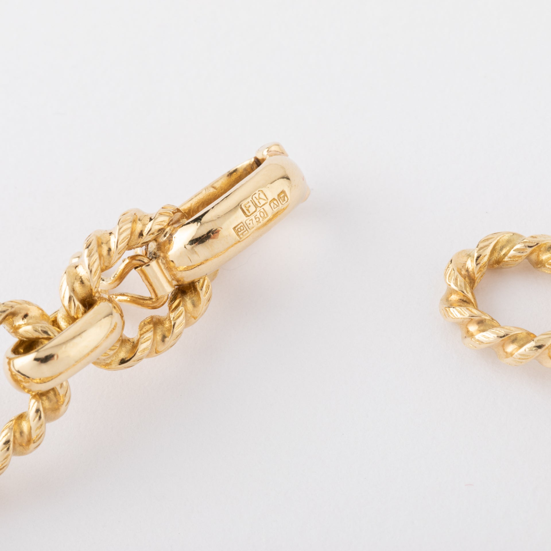 Vintage Piaget, a gold and tiger's eye watch on gold.