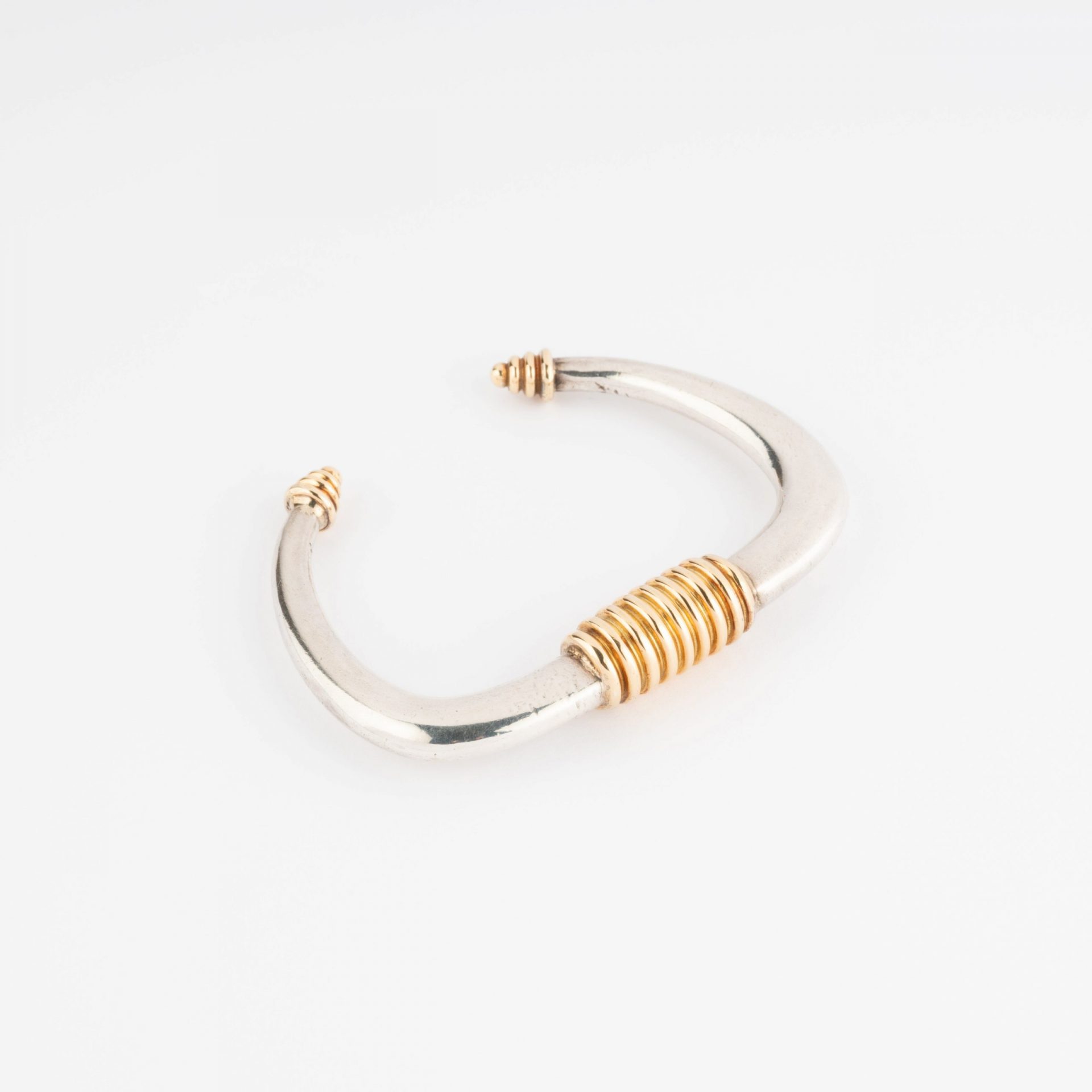 Silver and gold rigid bracelet from Zolotas