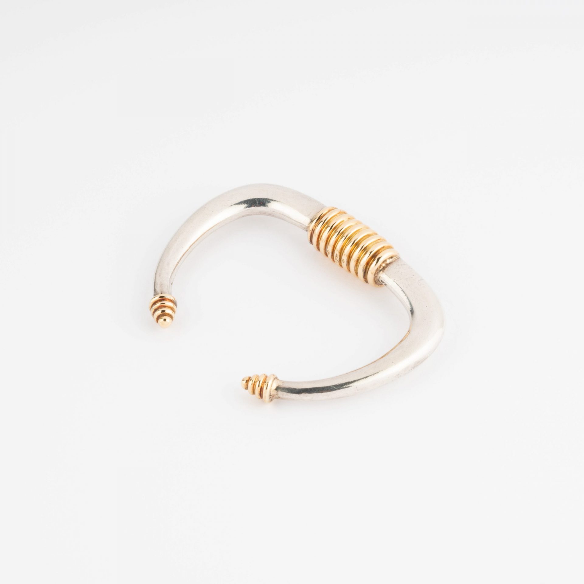 Silver and gold rigid bracelet from Zolotas