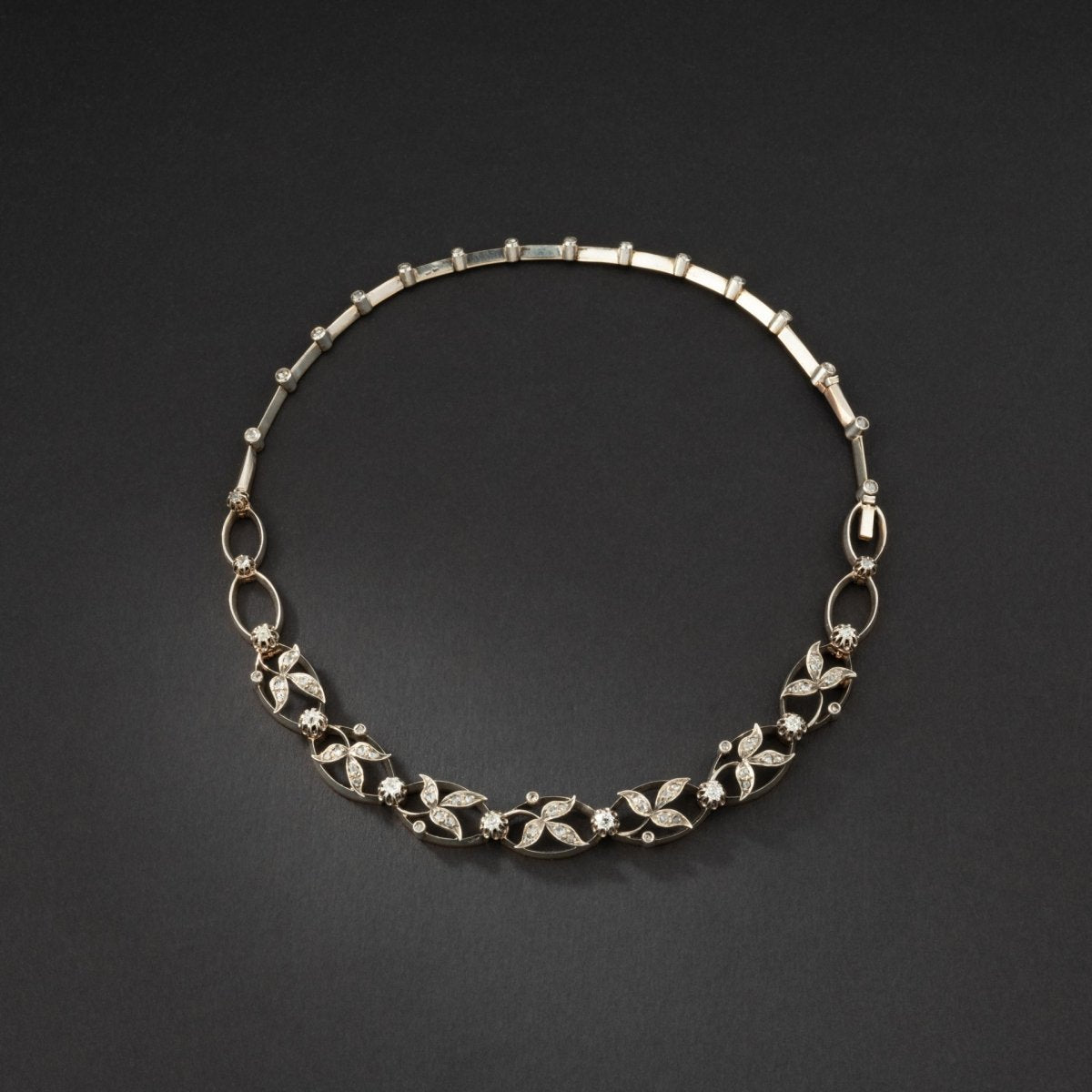 Collier transformable en deux bracelets en or et argent rehaussé de diamants. - Maison Eloe