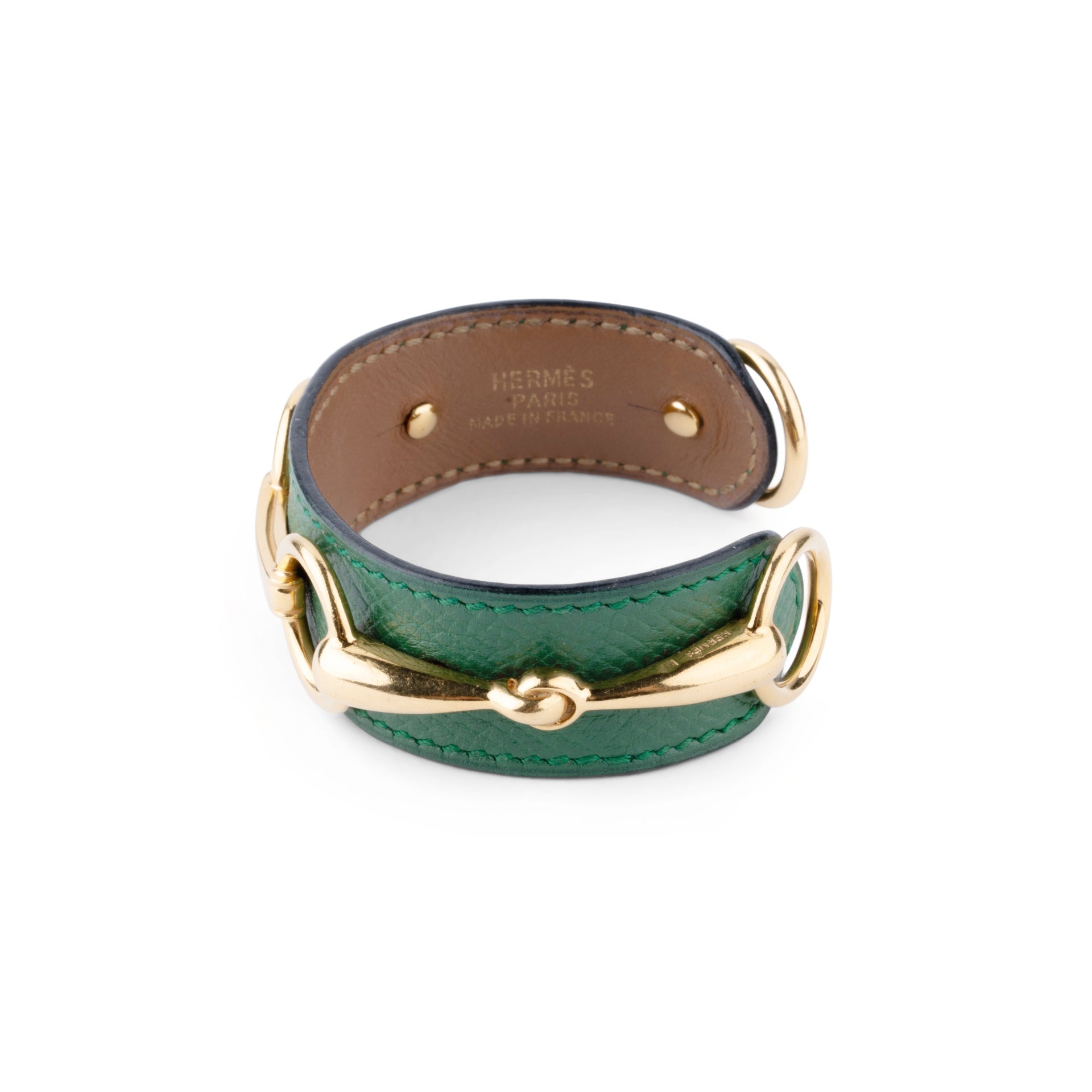 Bracelet from the house of Hermès in leather and gold metal