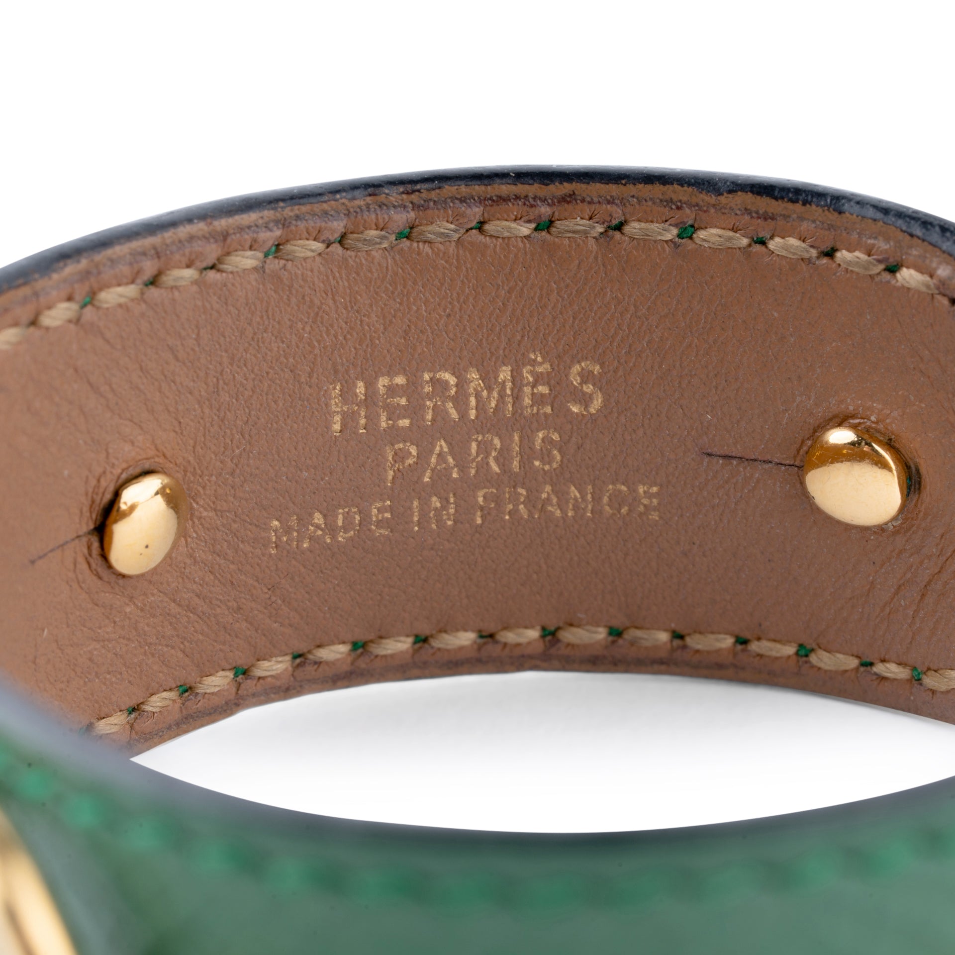 Bracelet from the house of Hermès in leather and gold metal