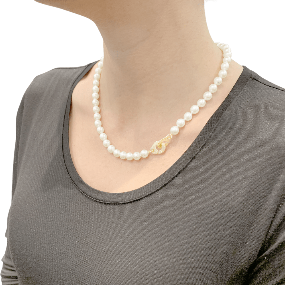 Collier de perles Dinh Van, "Menottes R12", en or jaune.