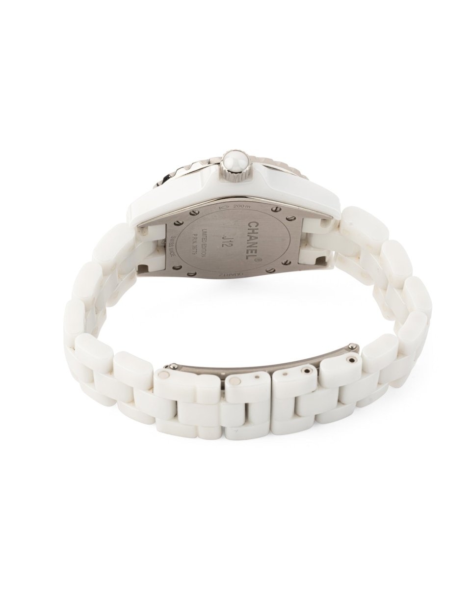 Montre Chanel J12 Edition limitée Lunette Bleue céramique blanche - Maison Eloe