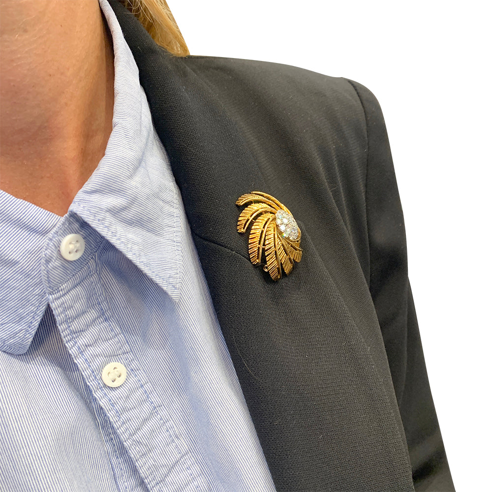 Clip vintage Cartier, or jaune et diamants.