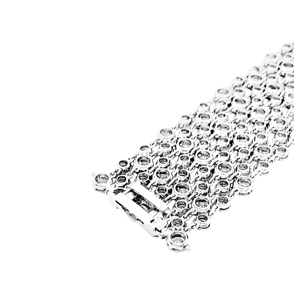 Bracelet souple, or blanc et diamants.
