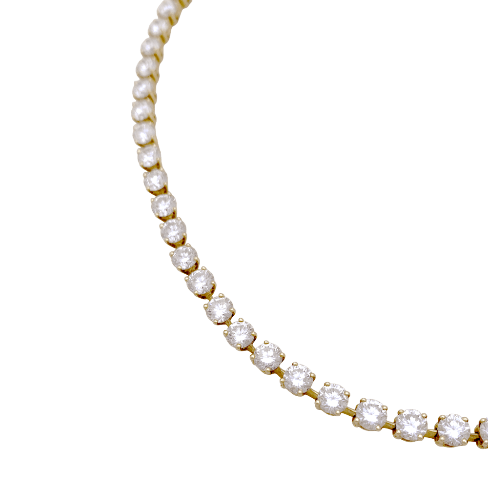 Collier rivière Cartier, or jaune et diamants.