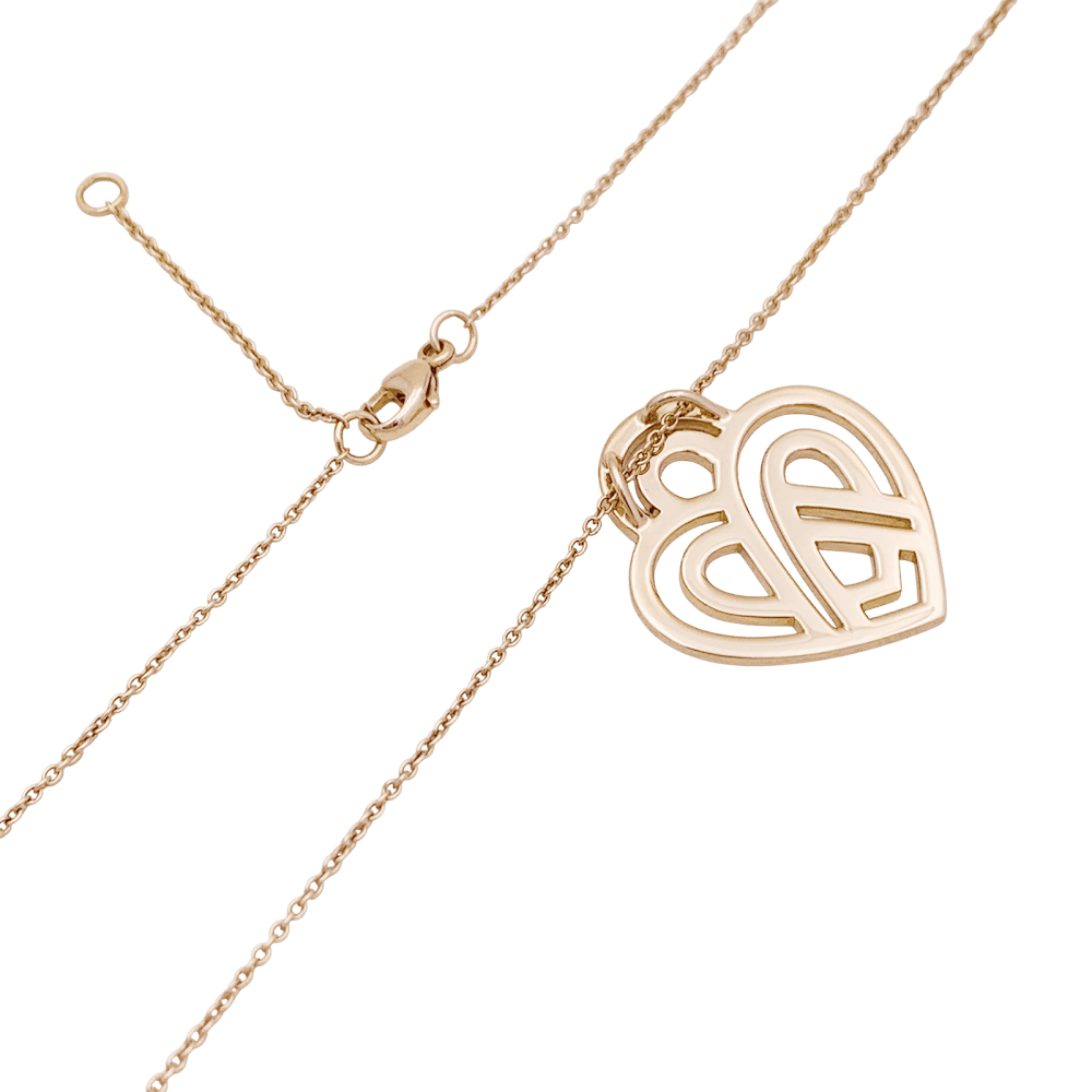 Collier Poiray, "Coeur entrelacé", or rose et diamants.