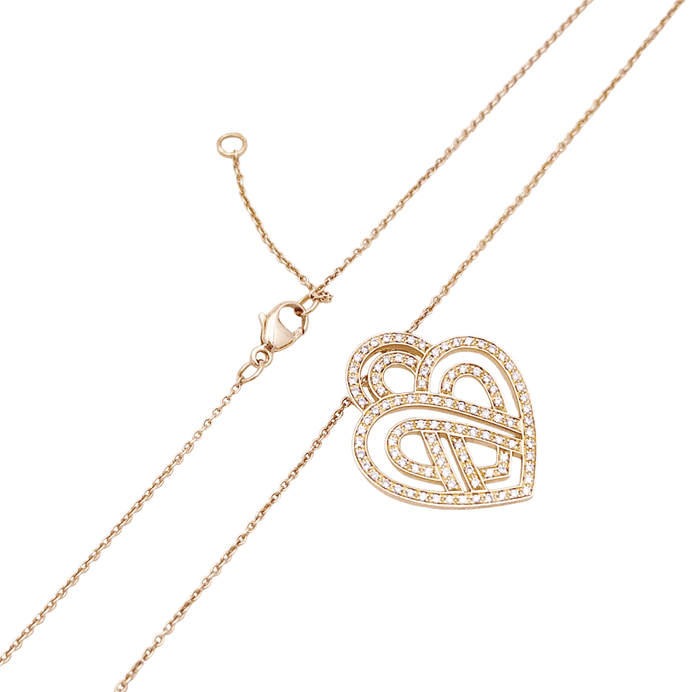 Collier Poiray, "Coeur entrelacé", or rose et diamants.