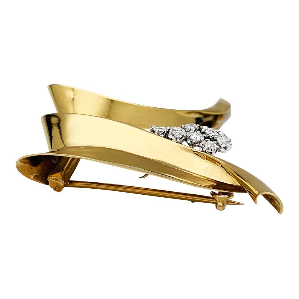 Broche Fontana en or jaune 750/000 et platine 950/000 sertie de 10 diamants taille ancienne. Poids brut : 11,4 grammes. - Maison Eloe