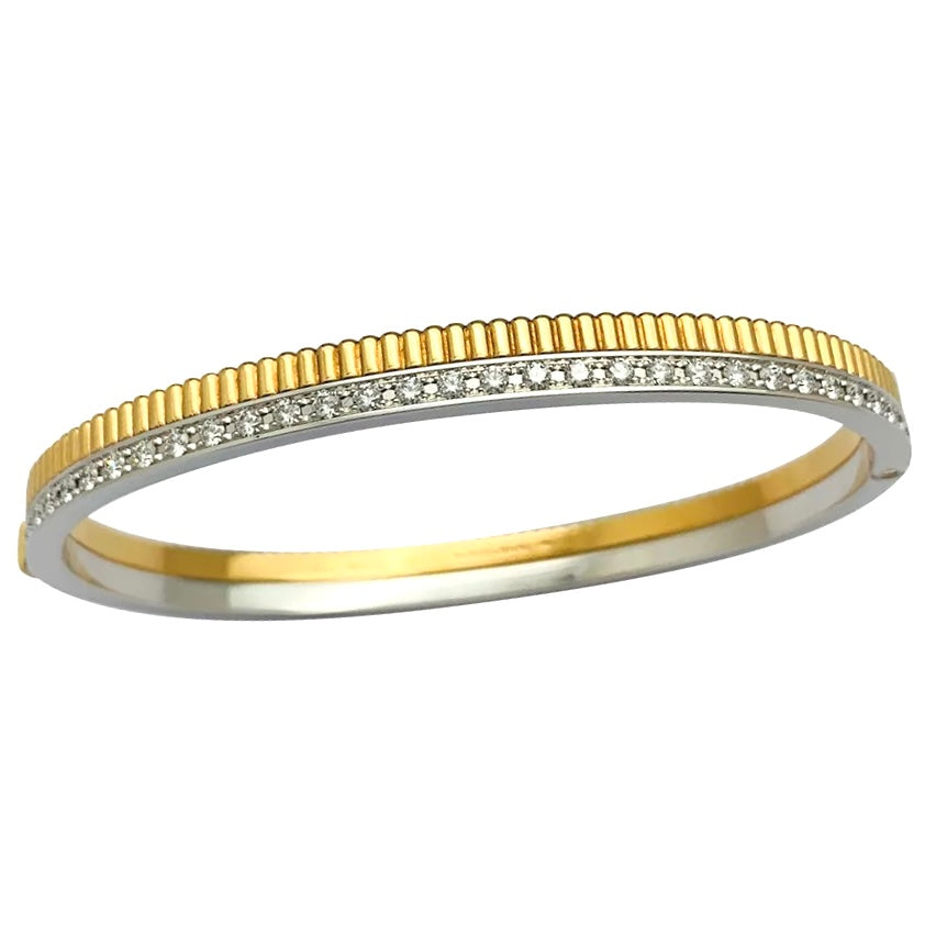 Boucheron bracelet, "Quatre Radiant", in yellow and white gold and diamonds.