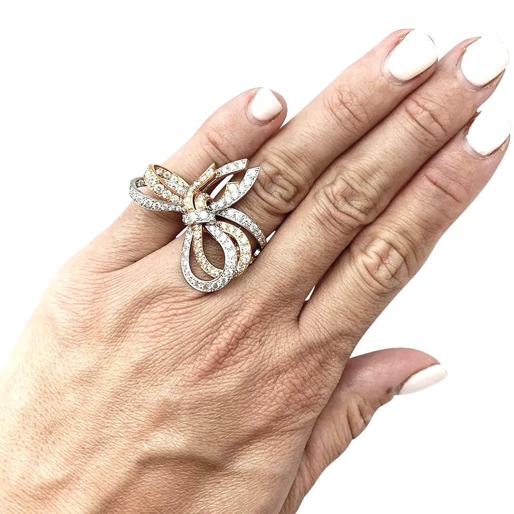 Van Cleef & Arpels ring, "Double Knot", white gold, pink gold, diamonds.