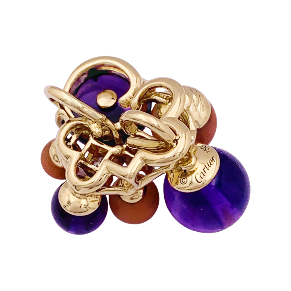 Pendentif Cartier "Délices de Goa" en or jaune, améthystes, corail et diamants.
