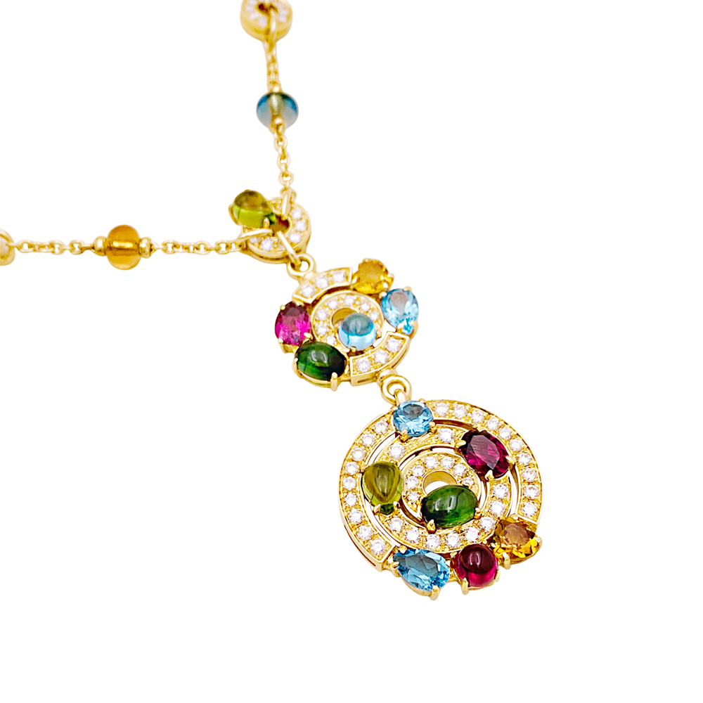 Collier BULGARI "Astrale", or jaune, diamants et pierres de couleur.
