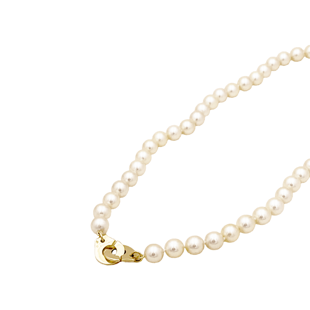 Collier de perles Dinh Van, "Menottes R12", en or jaune.