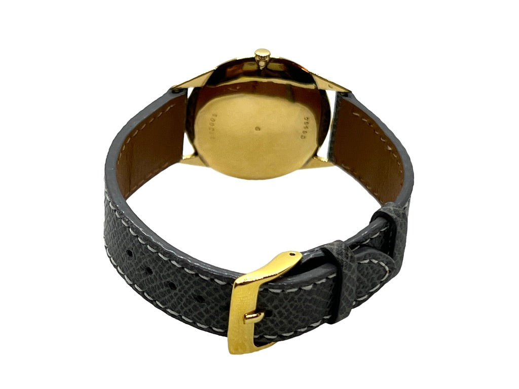 Van Cleef and Arpels, Gold watch on leather