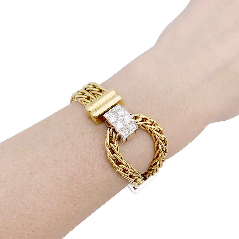Pomellato bracelet, "Corde", two golds, diamonds.