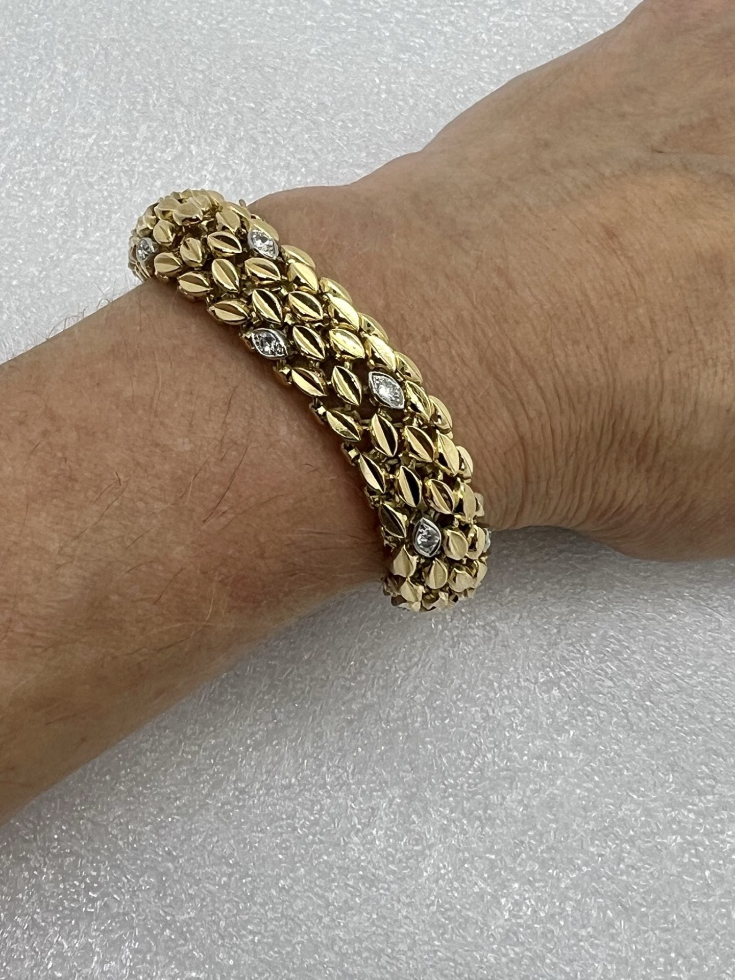 Bracelet maille grain de café or jaune 18K, platine et diamants.