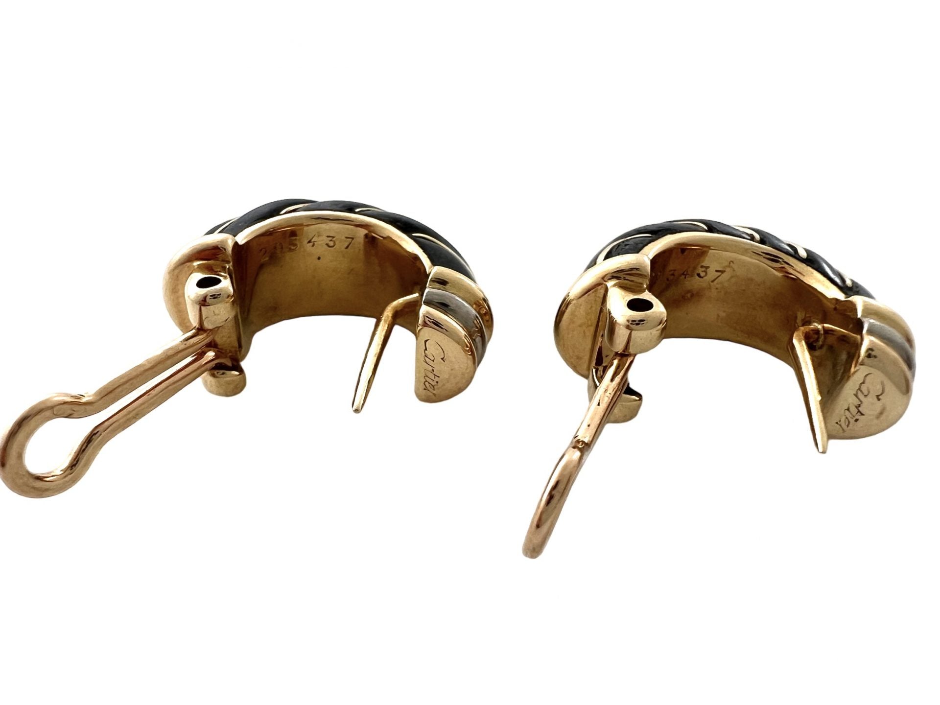 Cartier earrings in gold and oxidized silver in their case
