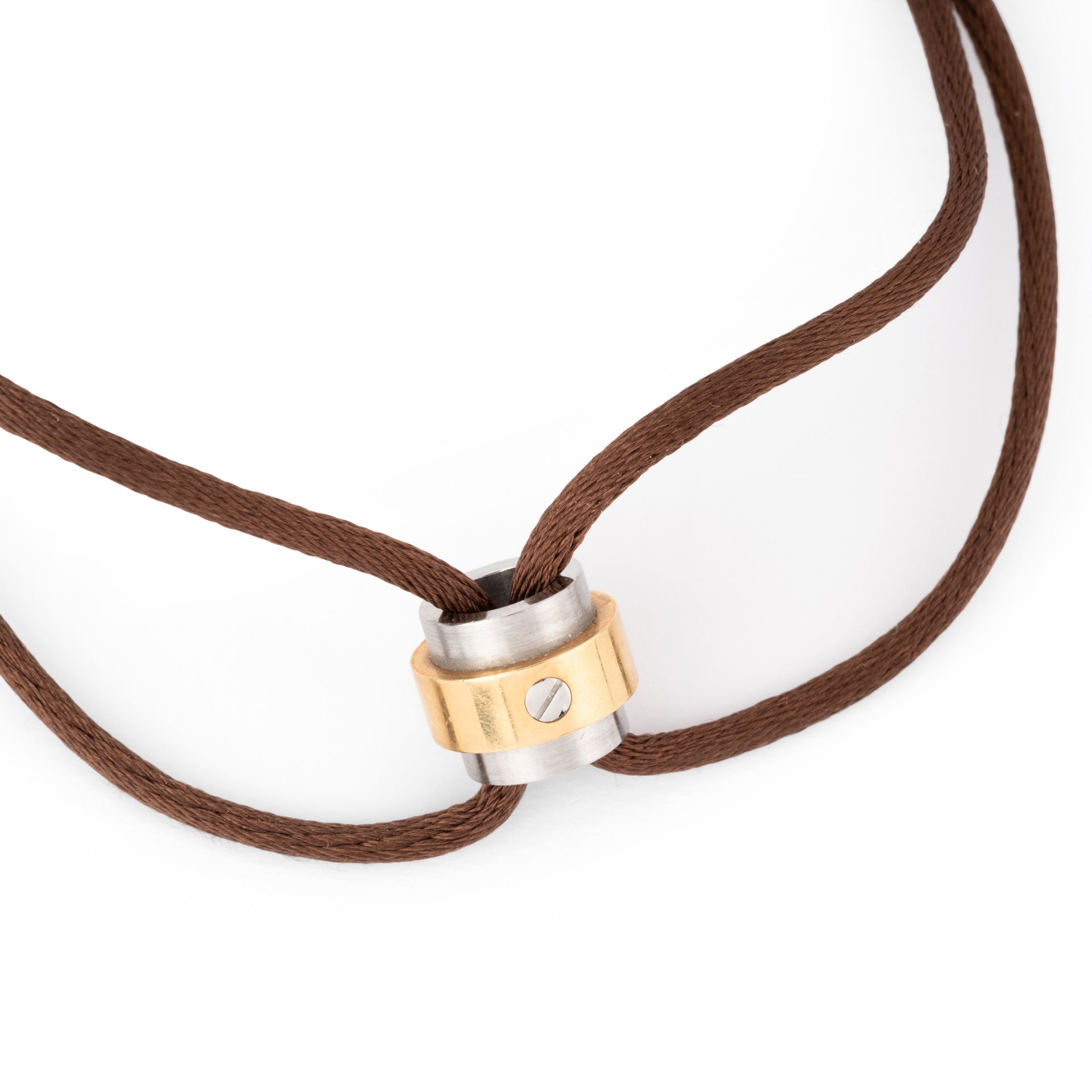 A Cartier gold and steel bracelet on a leather cord