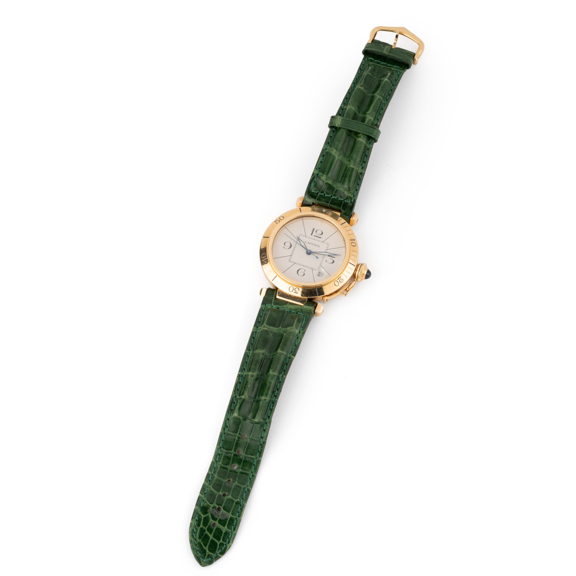 A Cartier "Pasha" watch in yellow gold on a leather strap