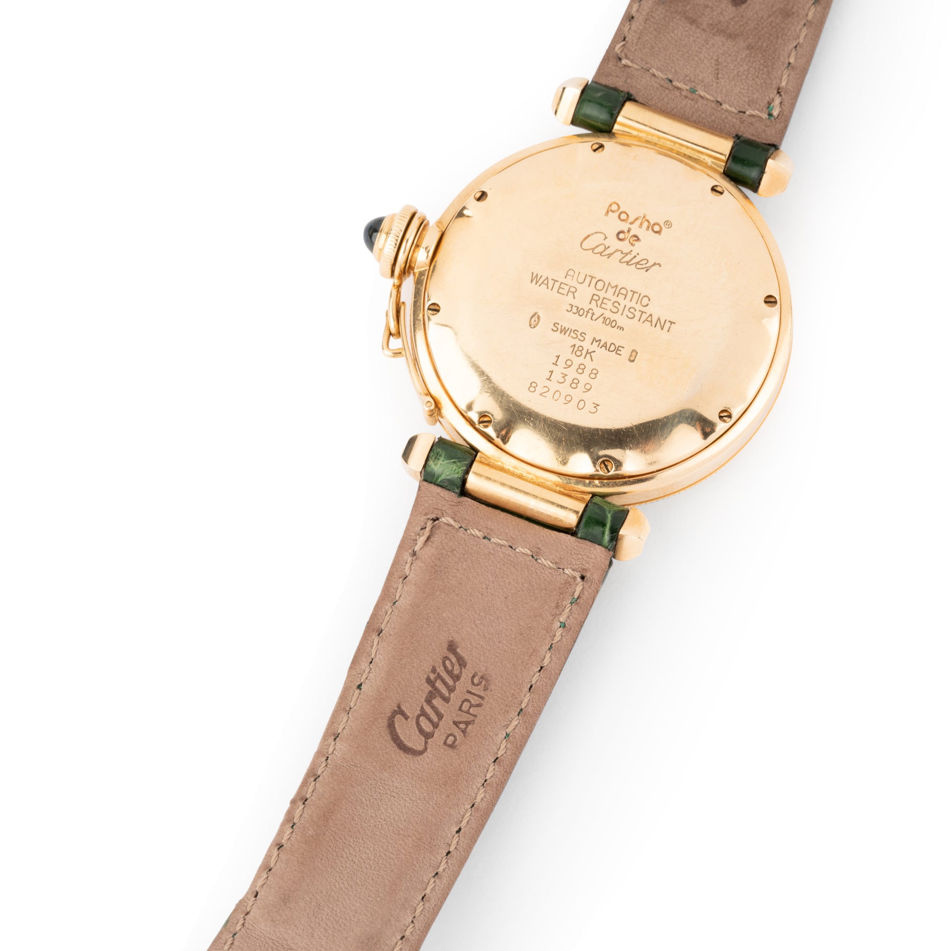 A Cartier "Pasha" watch in yellow gold on a leather strap