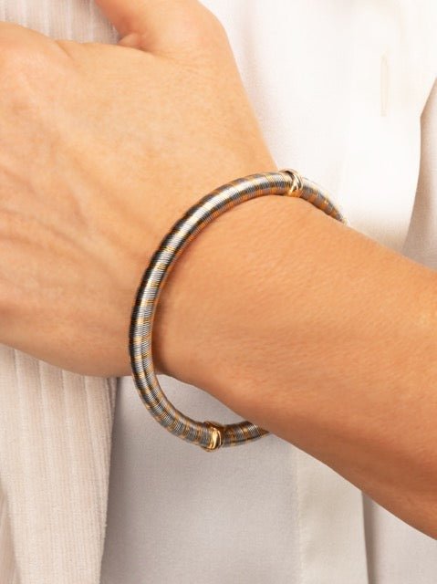 Cartier, bracelet Vintage en or jaune 18K et acier - Maison Eloe