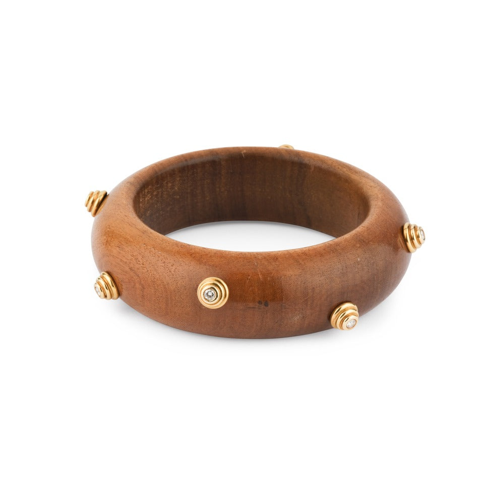 Bracelet Christian Dior en or jaune, bois et diamants.