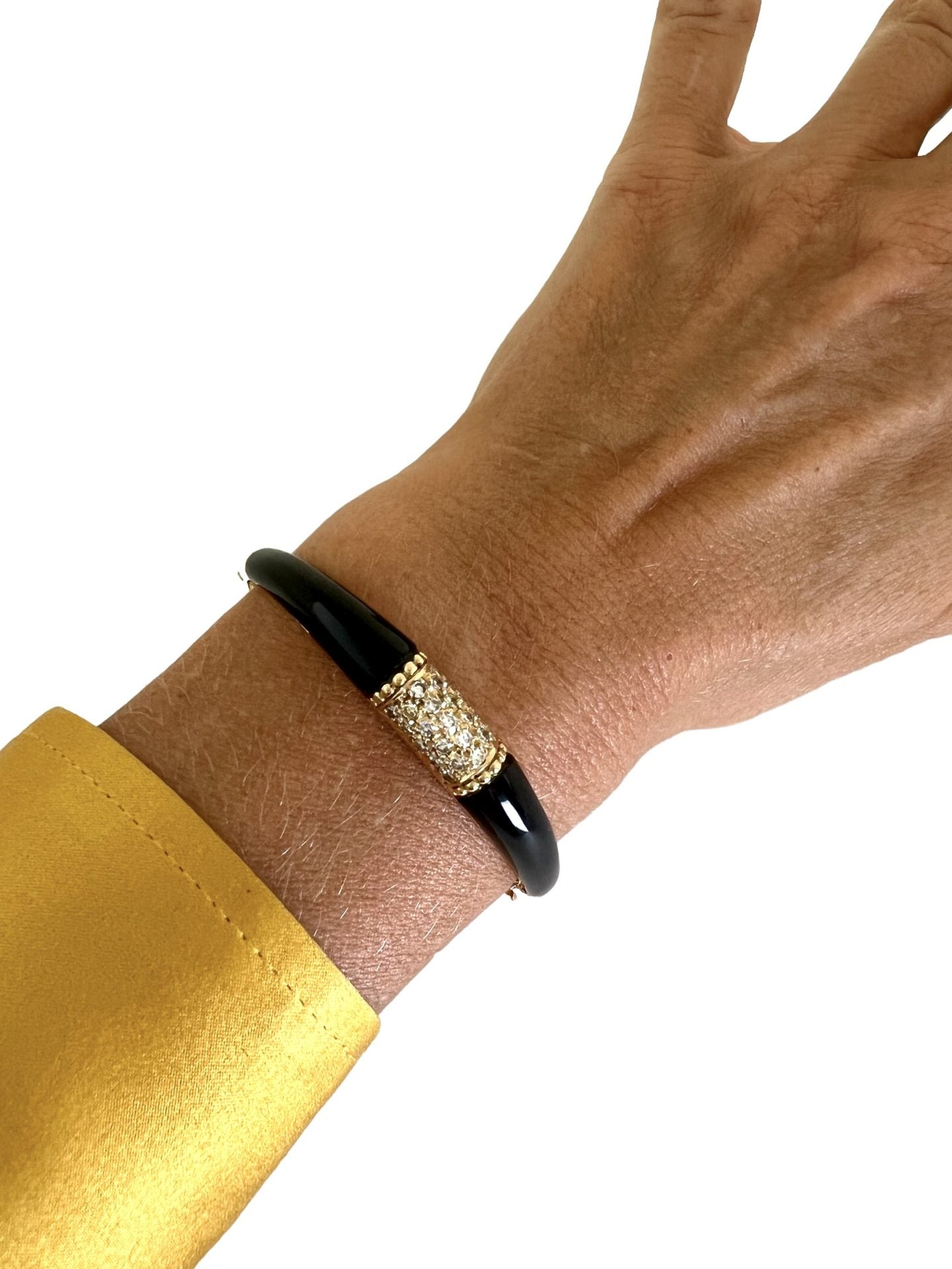 Bracelet signé Pierre et Jean Bellin en or, onyx et diamants.