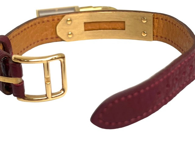 Hermès, Kelly gold-plated watch, burgundy dial
