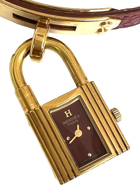 Hermès, Kelly gold-plated watch, burgundy dial