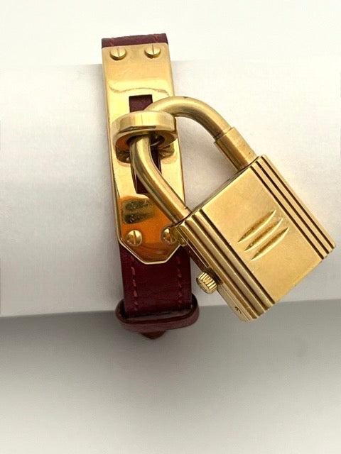 Hermès, Kelly gold-plated watch, burgundy dial