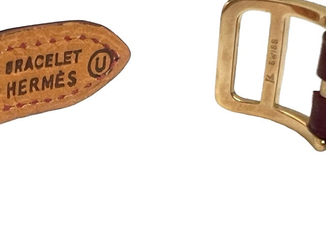 Hermès, Kelly gold-plated watch, burgundy dial
