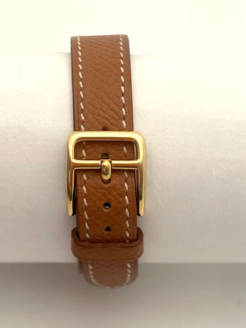 Hermès Kelly watch on gold leather strap