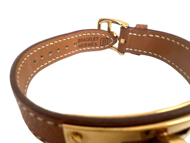 Hermès Kelly watch on gold leather strap