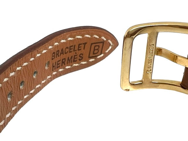 Hermès Kelly watch on gold leather strap