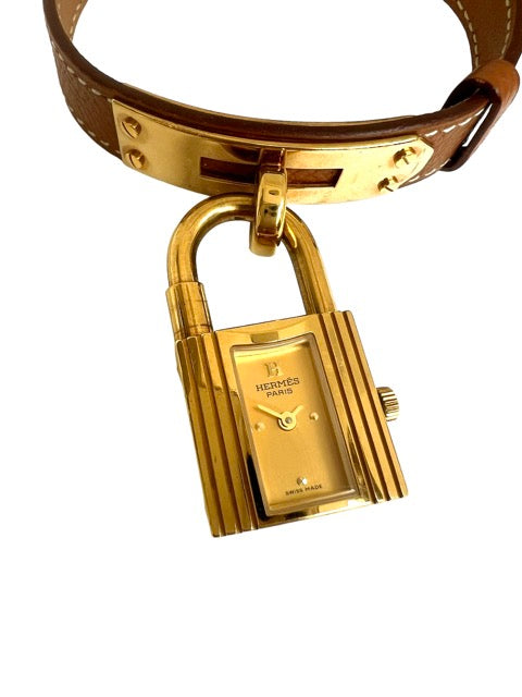 Hermès Kelly watch on gold leather strap