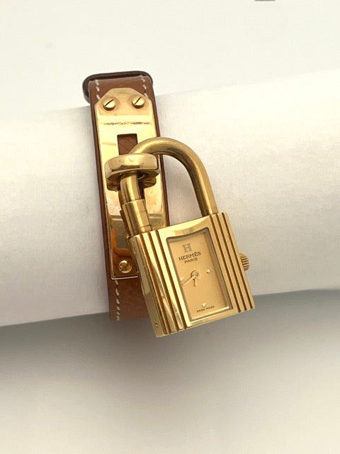 Hermès montre Kelly sur bracelet cuir gold