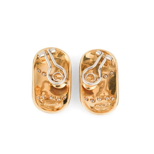 A pair of clip-on earrings from Illario in yellow gold, enamel and diamonds.