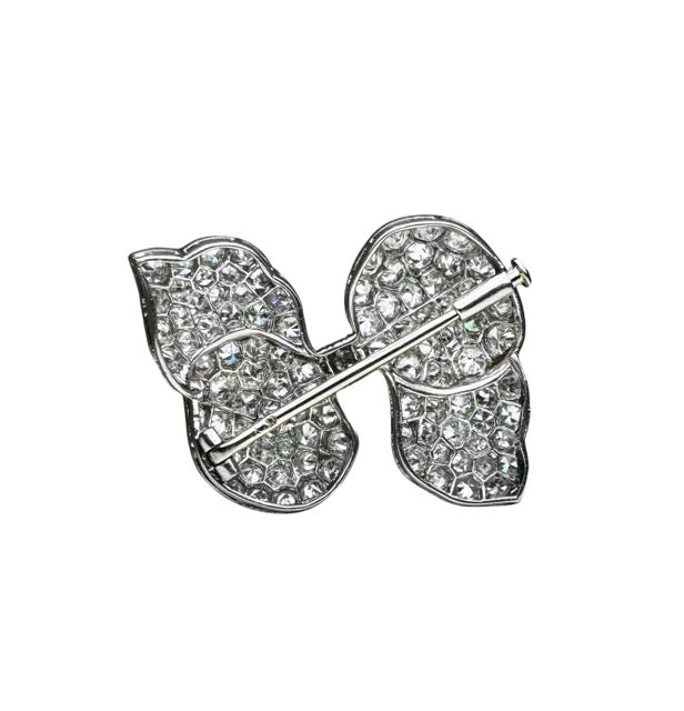 Lacloche Frères "Knot" brooch in platinum and diamonds