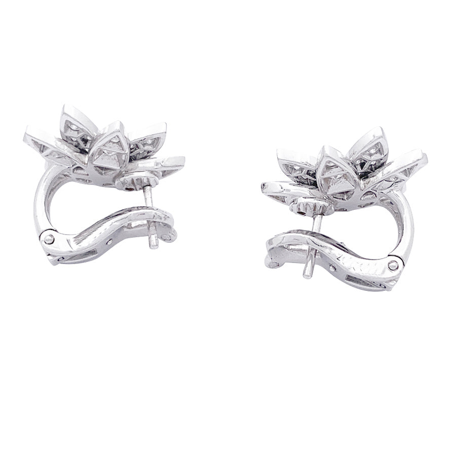 Van Cleef & Arpels "Lotus" earrings in white gold and diamonds.
