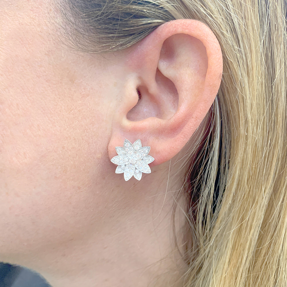 Van Cleef & Arpels "Lotus" earrings in white gold and diamonds.